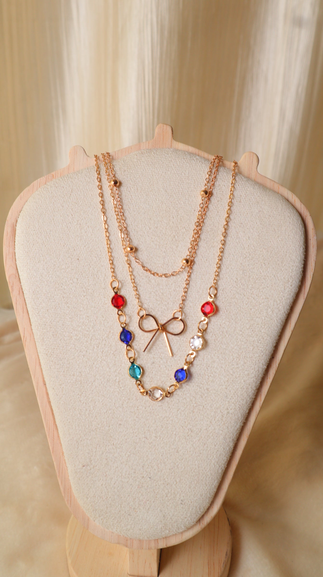Gold Layered Necklace Set for Women – 3-Piece Multi-Color Crystal & Bow Chain Combo