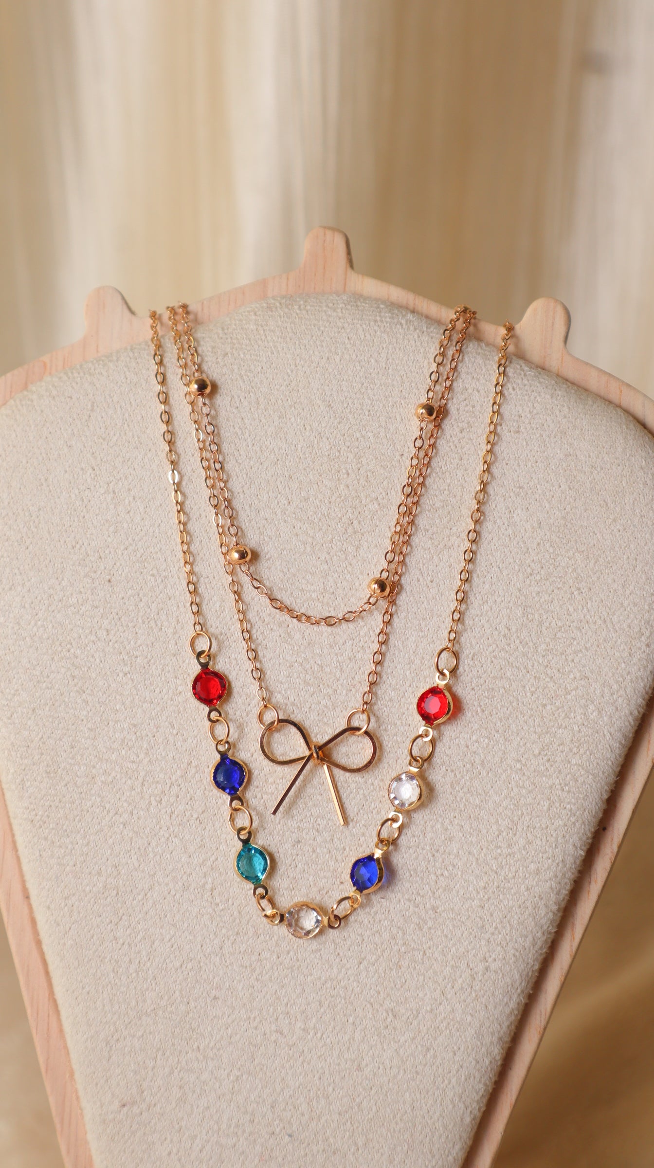 Gold Layered Necklace Set for Women – 3-Piece Multi-Color Crystal & Bow Chain Combo