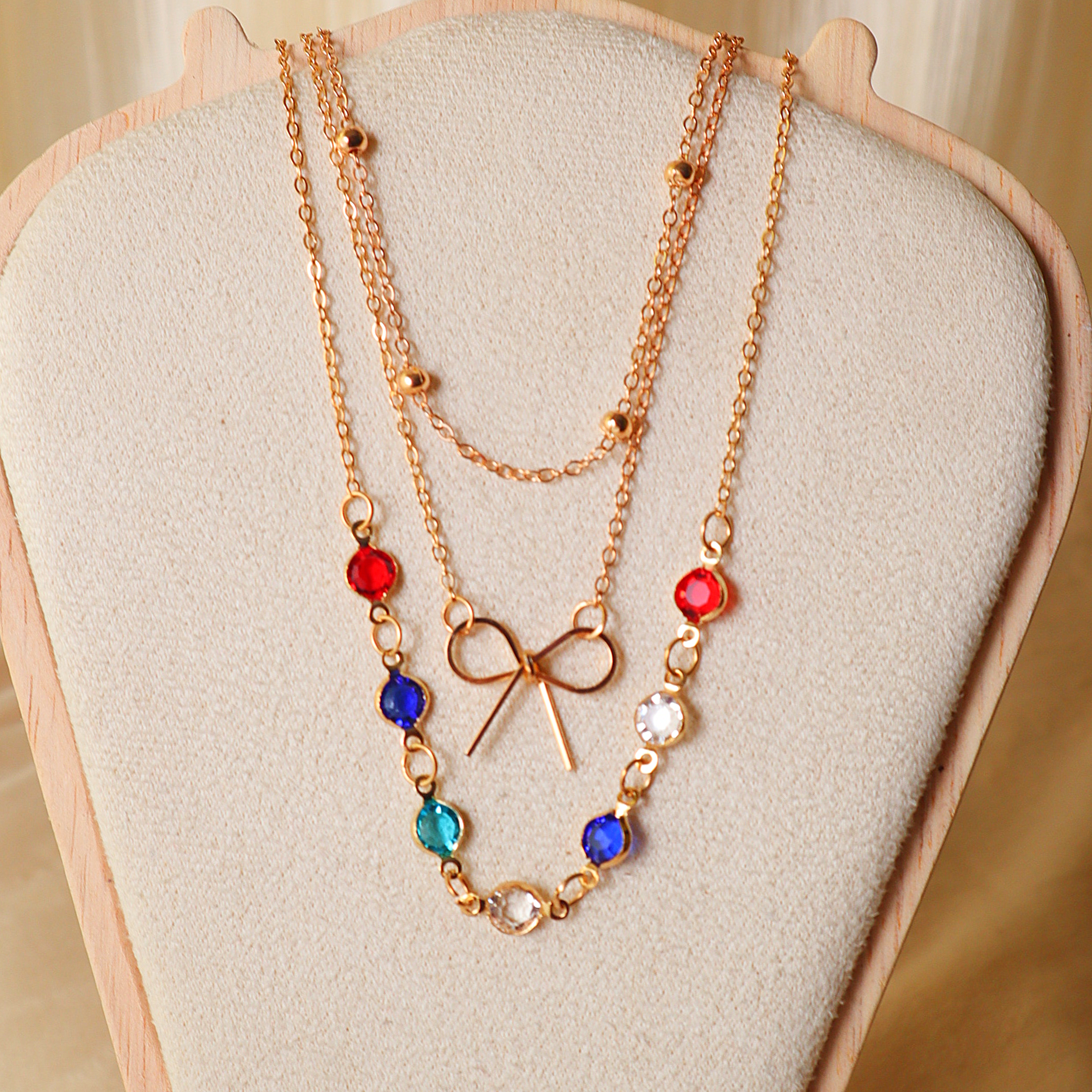 Gold Layered Necklace Set for Women – 3-Piece Multi-Color Crystal & Bow Chain Combo