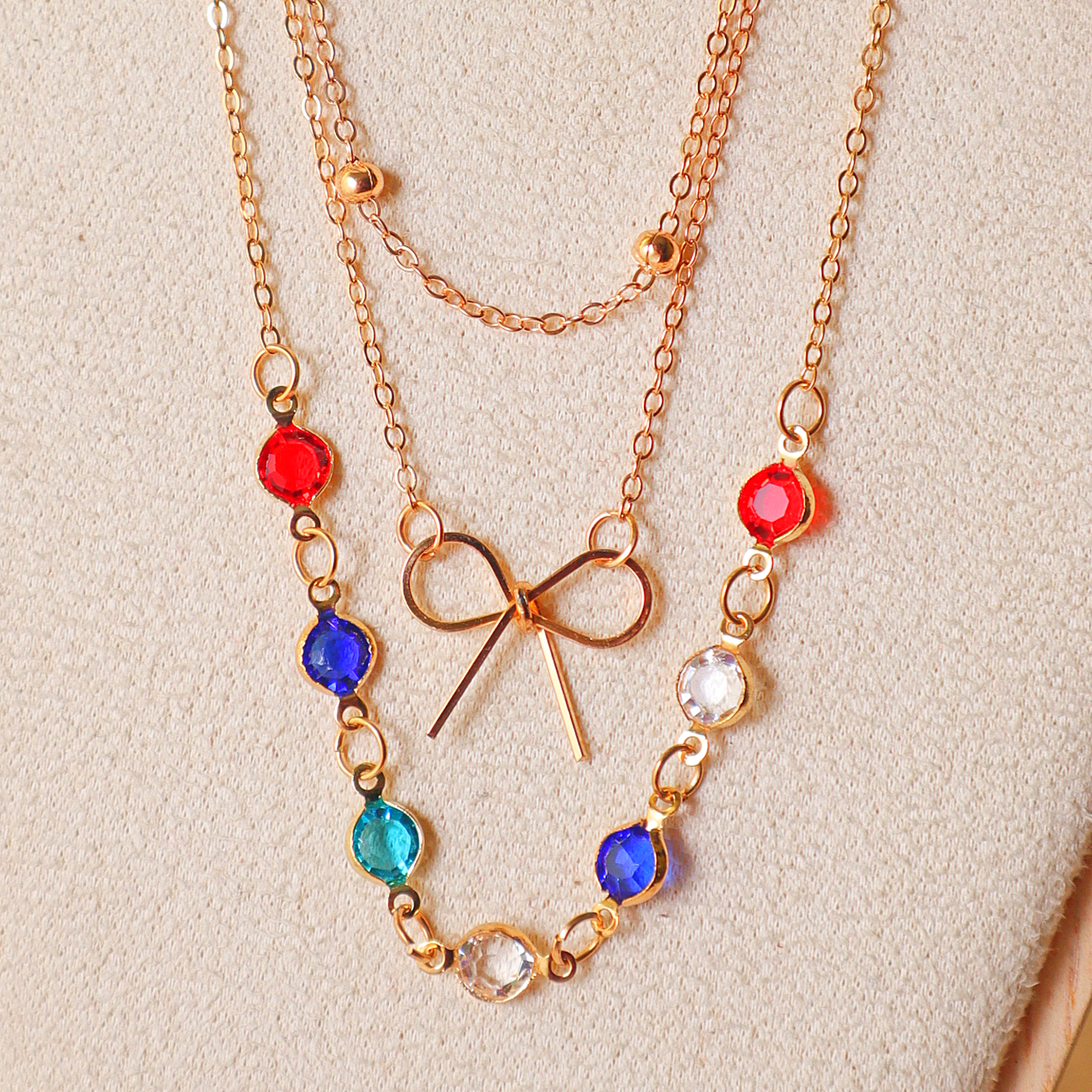 Gold Layered Necklace Set for Women – 3-Piece Multi-Color Crystal & Bow Chain Combo