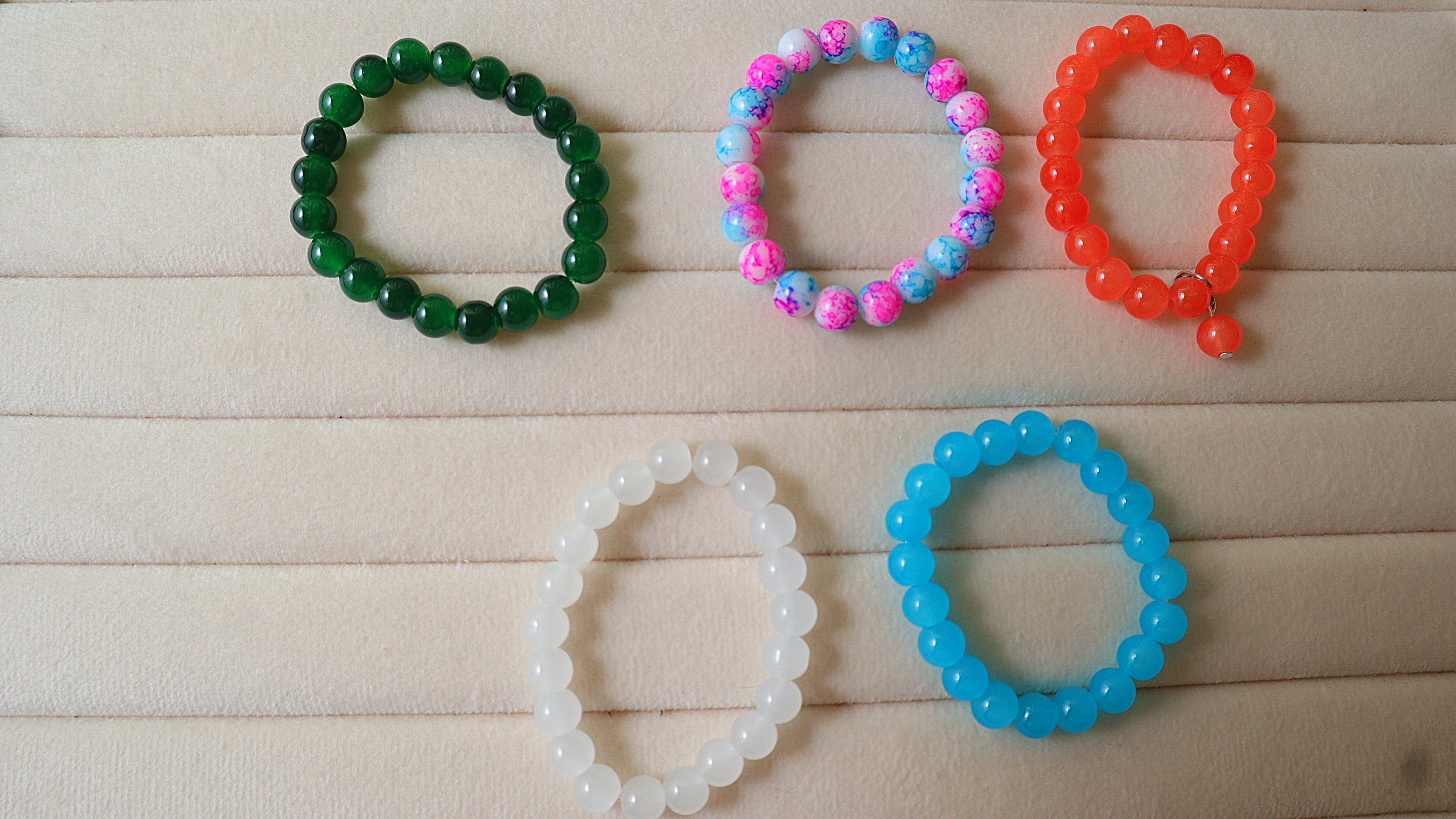5-Pack Handmade Beaded Bracelets | Emerald Green, Pink Blue Splatter, Tangerine, White & Sky Blue