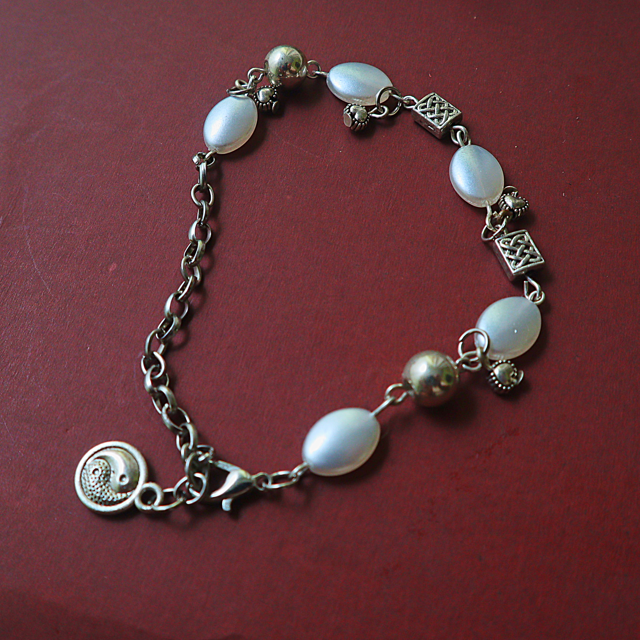 Mother of Pearl Oval Bead Link Bracelet – Silver Celtic Knot Spacers & Yin Yang Charm Drop