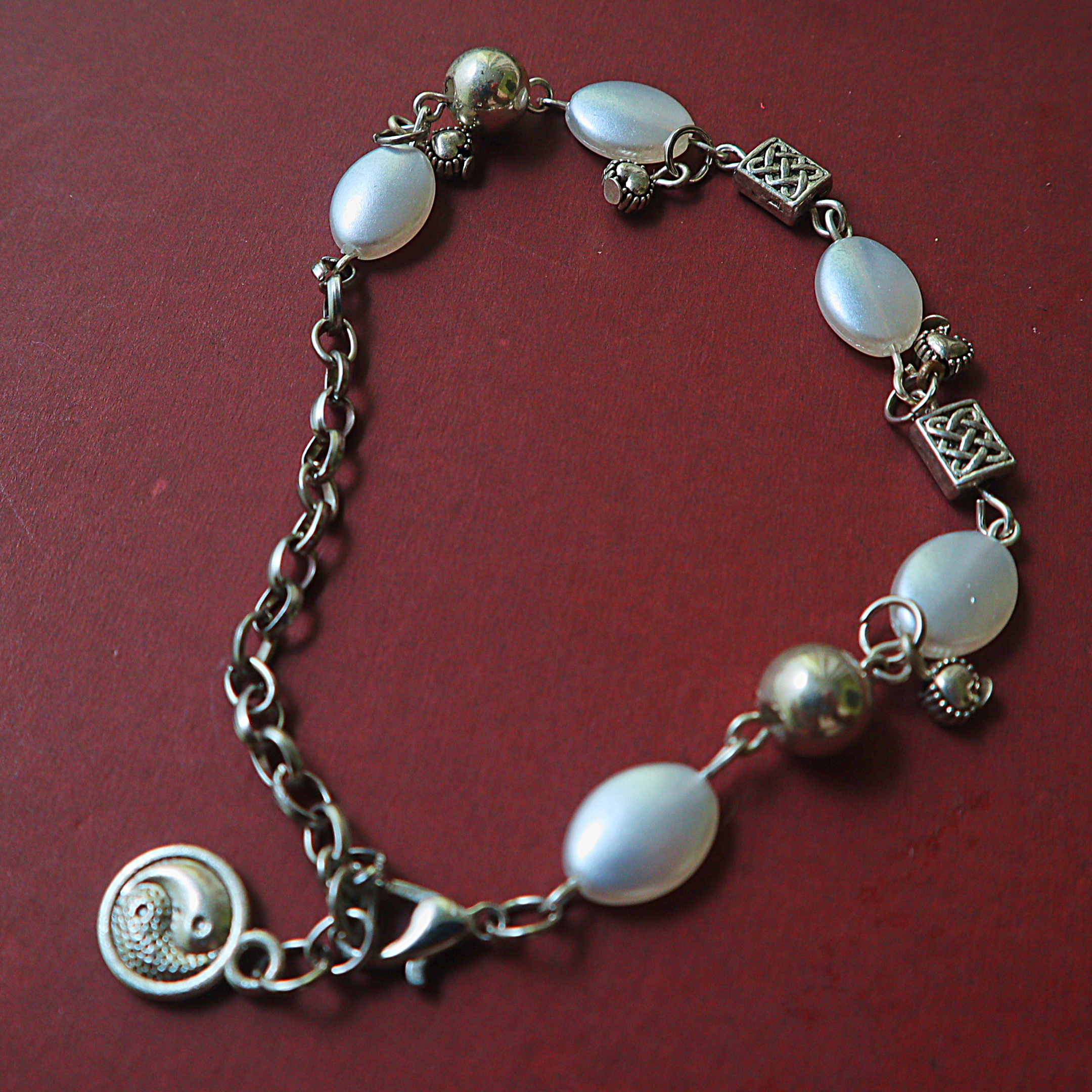 Mother of Pearl Oval Bead Link Bracelet – Silver Celtic Knot Spacers & Yin Yang Charm Drop