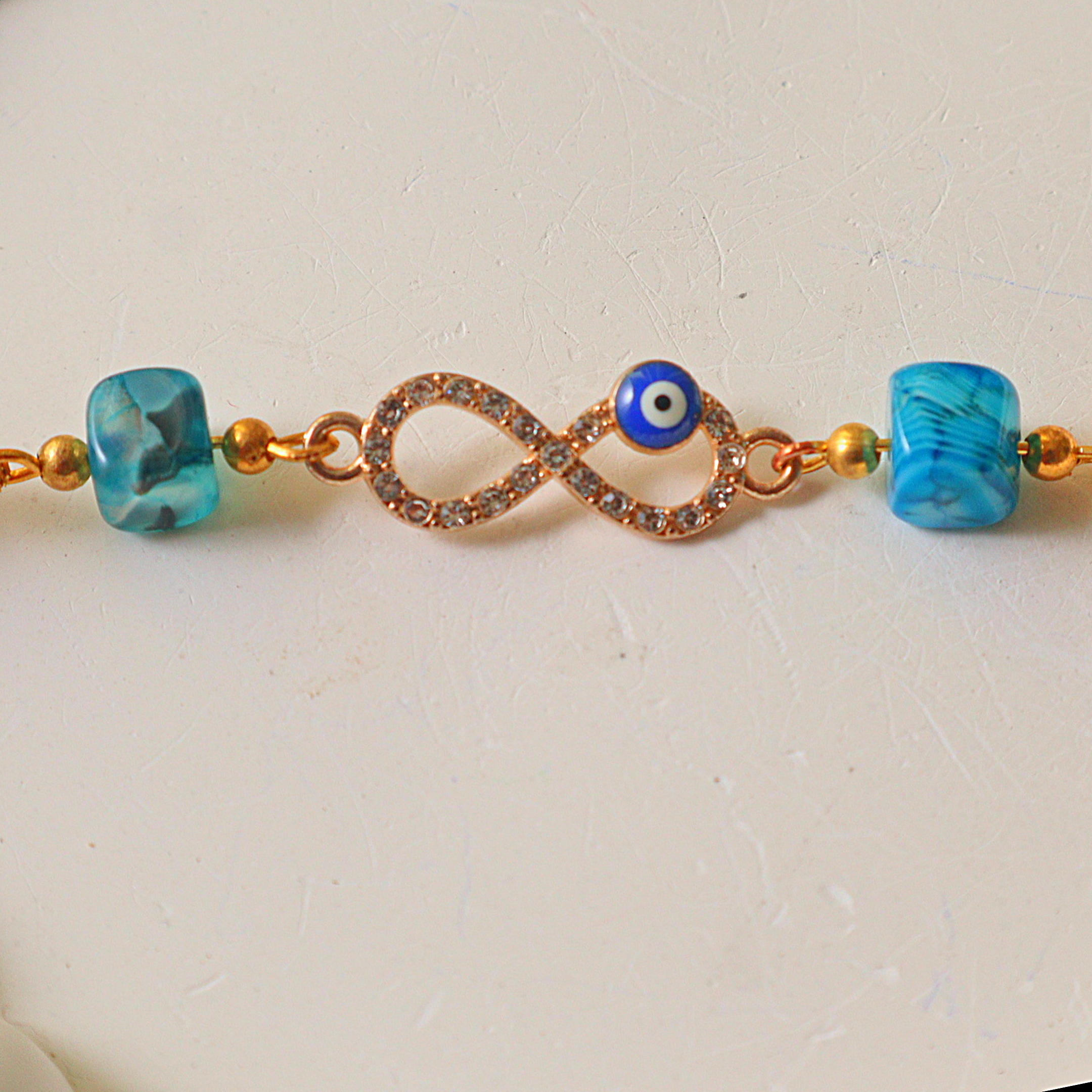 Rhinestone Infinity & Blue Evil Eye Bracelet with Marbled Square Glass Beads