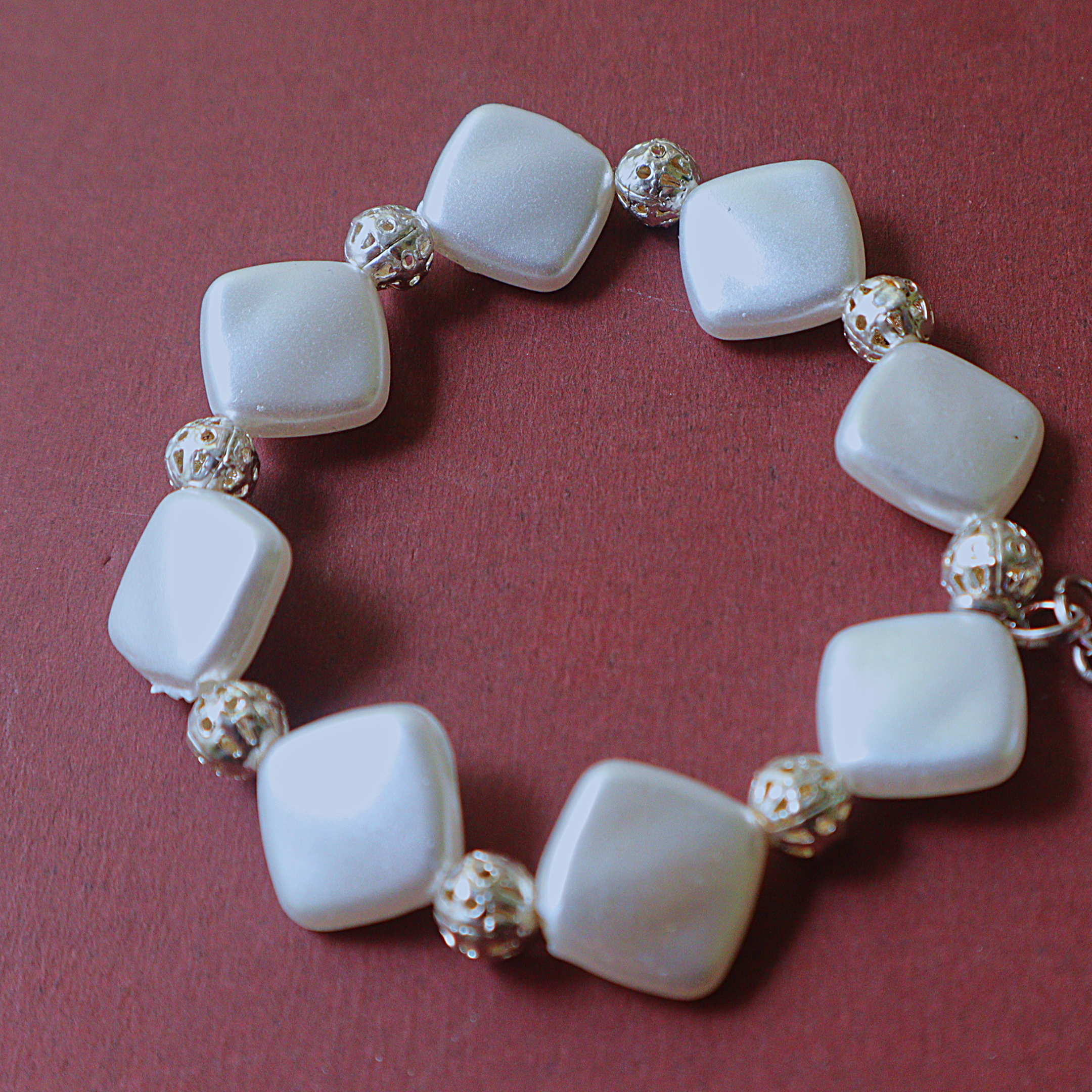 Handmade White Pearlescent Square Bead Bracelet with Filigree Spacers & Lily Charm