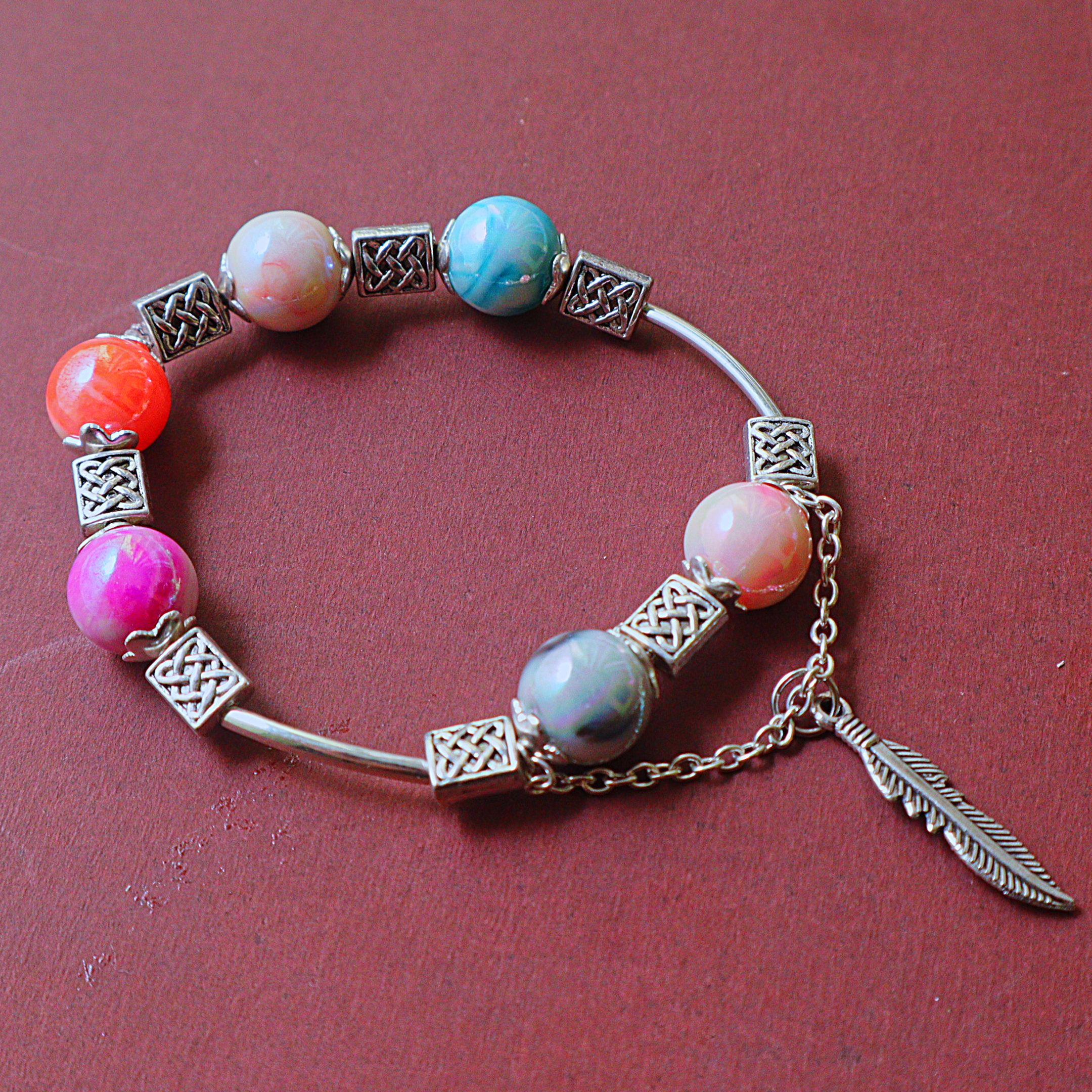 Handmade Multi-Color Marbled Bead Bangle Bracelet with Celtic Knot Spacers & Feather Charm