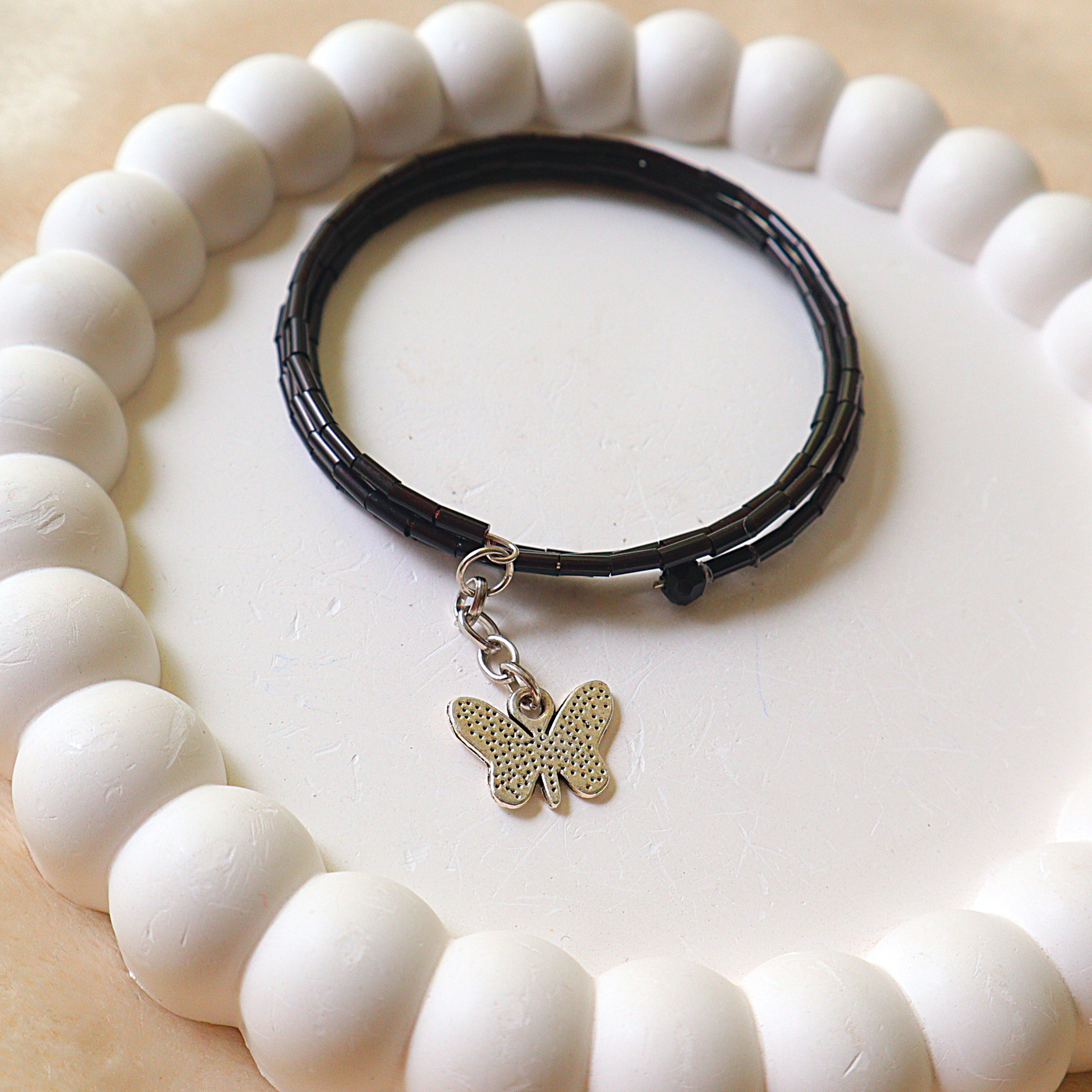 Handmade Black Bugle Bead Memory Wire Wrap Bracelet with Silver Butterfly Charm