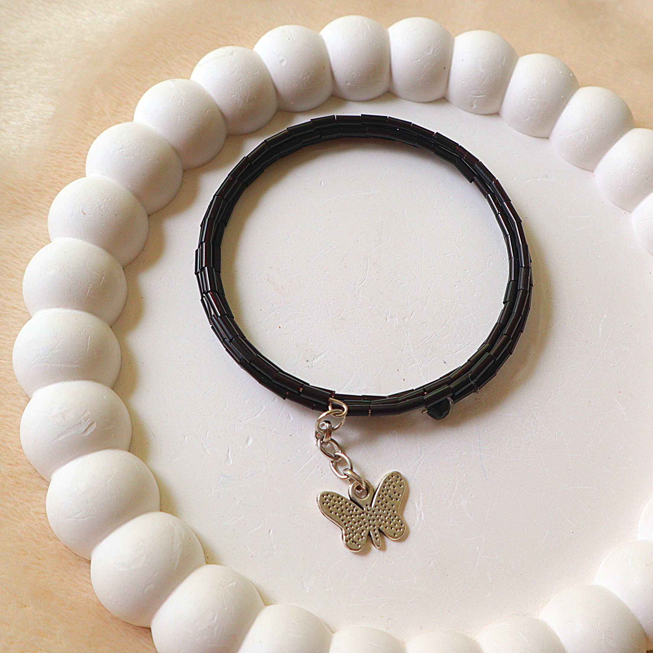 Handmade Black Bugle Bead Memory Wire Wrap Bracelet with Silver Butterfly Charm